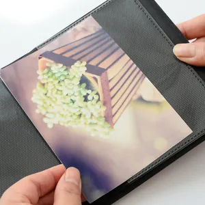 Close-up detail of 3-inch photo album pocket, clear plastic sleeve holding card.
