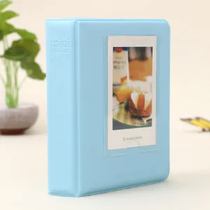 Light blue mini polaroid photo album detail shot, cute candy color card holder pocket.