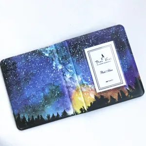 Detailed view of the starry sky mini photo album pocket showing inner card and clear slot.