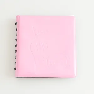 Pink 3 inch instax mini photo album detail showing the cute embossed cover and black ring binder.