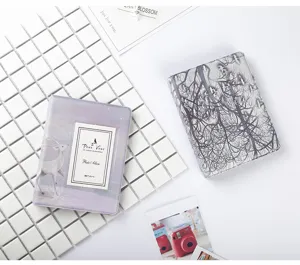 Detailed view of 3-inch Polaroid photo album, 64 pockets insert design, aesthetic style.