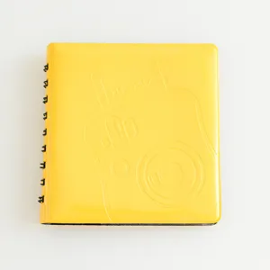 Yellow 3-inch mini photo album with coil binding, cute Instax camera embossed cover design.