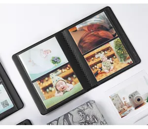 Detail view of a black leather 3 inch instax mini photo album with clear pocket sleeves.