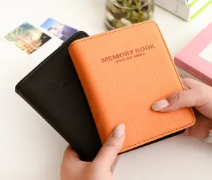 Mini photo album for 3-inch instant photos, PU leather pocket book, black and orange.