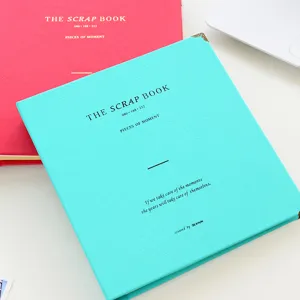 Close-up of macaron color leather scrapbook album cover with elegant English typography print.