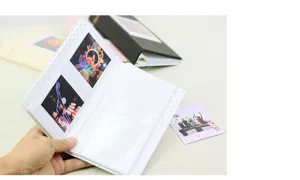 Compact square photo album detail view, transparent insert pockets for instant film storage.