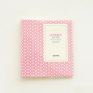 Mini pink geometric pattern photo album for 3 inch polaroid pictures and small cards.