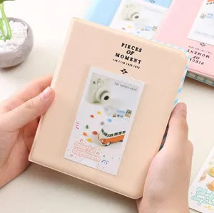 Detailed close-up of a cute mini photo album with clear pocket and lovely text insert card.