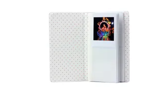 White mini square photo album with red dot pattern, insert pockets for instant film photos.