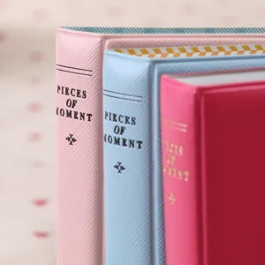 Detail view of 3 inch instax mini photo album book spine with cute pastel color design.