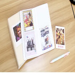Detail view of square instant photo album insert designed for holding memory photos securely.