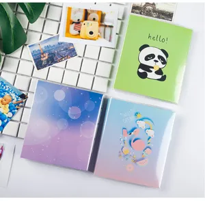 Detailed view of mini 3-inch photo albums featuring cute designs like panda and flamingo.
