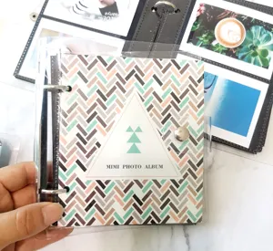 Clear loose-leaf photo album with geometric cover design, ideal for 3 4 5 inch pictures.