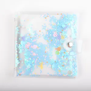 Clear PVC loose-leaf photo binder detail showing colorful glitter sequins and snap closure.