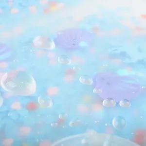 Close-up detail shot of PP photo album cover with blue water drops and glitter design.