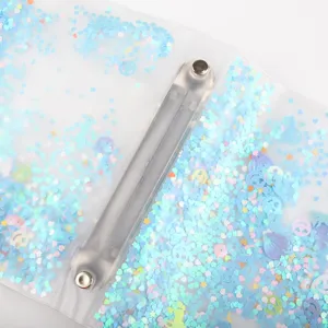 Clear PP loose-leaf photo album detail with blue holographic glitter sequins, perfect for binder storage.