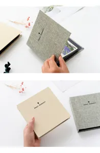 Linen photo album with loose-leaf design, ideal for storing 3-inch or 4-inch pictures and tickets.