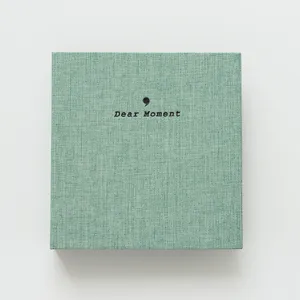 Detail view of the green fabric photo album, designed for 3 4 5 inch picture storage book.