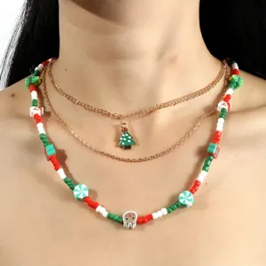 Collier de perles multicouche de Noël avec pendentif d'arbre de fête, bijou chic.