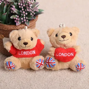 Detailed close-up view of adorable plush teddy bear toys with London souvenir embroidery.