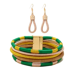 Handcrafted multi-layer rope wrapped jewelry set featuring a bold statement cuff and matching earrings.