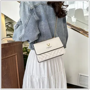 Elegant white quilted shoulder bag with gold chain strap, stylish daily crossbody accessory.