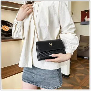 Black quilted crossbody bag for women featuring gold chain strap and metal deer logo.