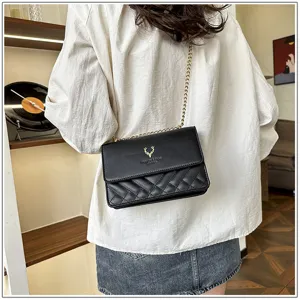 Stylish black quilted shoulder bag for women with chic chain strap and elegant deer logo design.