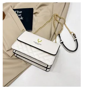 White quilted shoulder bag detail, elegant chain strap and chic clasp for daily fashion wear.