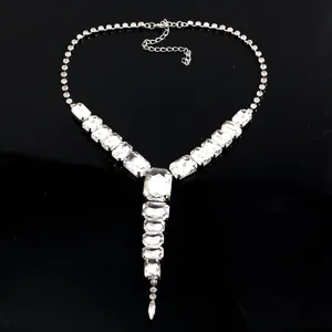 Detail view of European fashion exaggerated long glass rhinestone Y-shaped necklace jewelry.