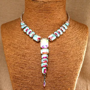 Detailed view of the statement iridescent crystal Y-necklace, glowing with multi-color brilliance.