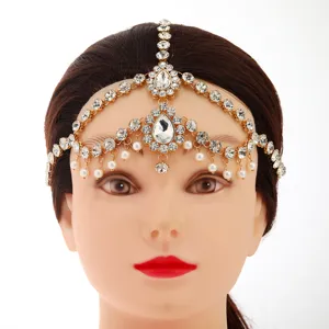 Bohemian rhinestone forehead jewelry, gold head chain, exquisite hair accessory detail.