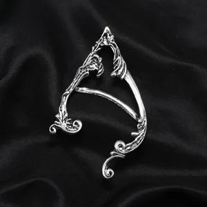 Detail view of a vintage gothic silver elf ear cuff, unique dark fantasy ear wrap for women.