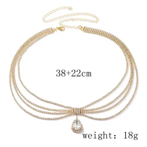 Detailed view of multi-layer rhinestone tassel forehead chain, elegant gold alloy design.