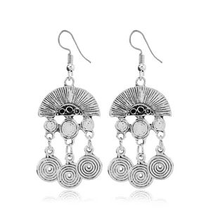 Detailed close-up of retro bohemian alloy dangling earrings with intricate spiral pendant motifs.