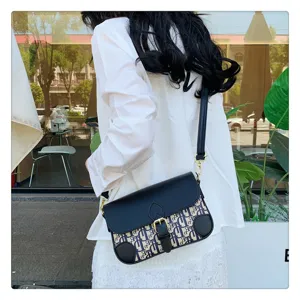 Vintage monogram crossbody bag for women, chic saddle flap design with PU leather.