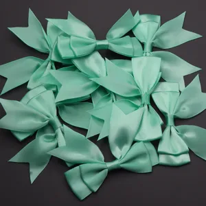 Detailed shot of mint green satin ribbon bows, soft double layer DIY accessory material