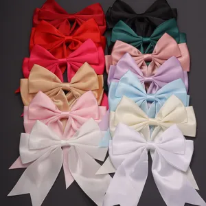 Close-up of colorful satin ribbon bows, double layer swallowtail design for DIY hair clips.