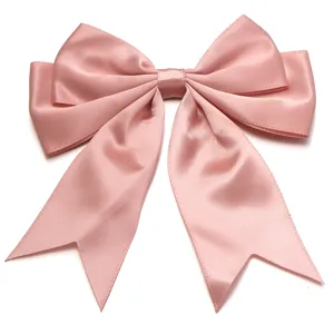 Pink satin double layer swallowtail bow detail close-up for hair clip and gift wrapping.