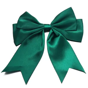 Detailed view of a dark green satin bow accessory, perfect for gift wrapping and DIY crafts.