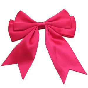 Pink polyester double-layer swallowtail bow detail for hair clips or gift wrapping.