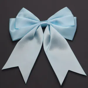 Close-up detail of light blue polyester double-layer bow accessory for DIY crafts and gifts.
