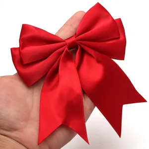 Red satin swallowtail bow detail, perfect for hair clips, gift wrapping and DIY crafts.