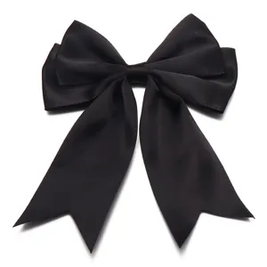 Black double-layered ribbon bow detail showing neat swallowtail edge and texture.