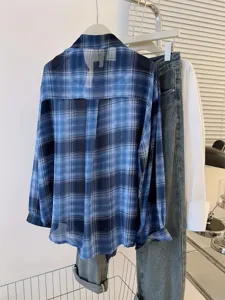 Detailed view of the women's blue plaid chiffon sun protection shirt, lightweight and casual.
