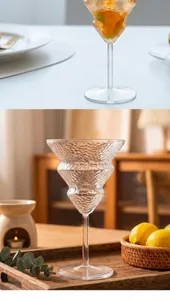 Detailed shot of unique Christmas tree shaped glass cocktail cup with hammered texture detail.