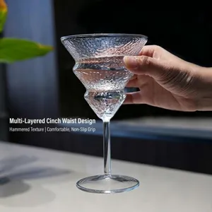 Elegant hammered glass goblet with multi-layer waist design for elegant cocktail serving.