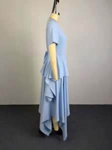 Light blue asymmetrical tiered midi dress with short sleeves and high waist side view detail.