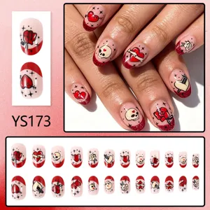 Short glossy press-on false nails detail view showing gothic heart rose skull designs.