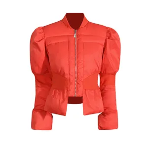 Detail view of vibrant red winter puffer jacket featuring stylish puff sleeves and front zipper.